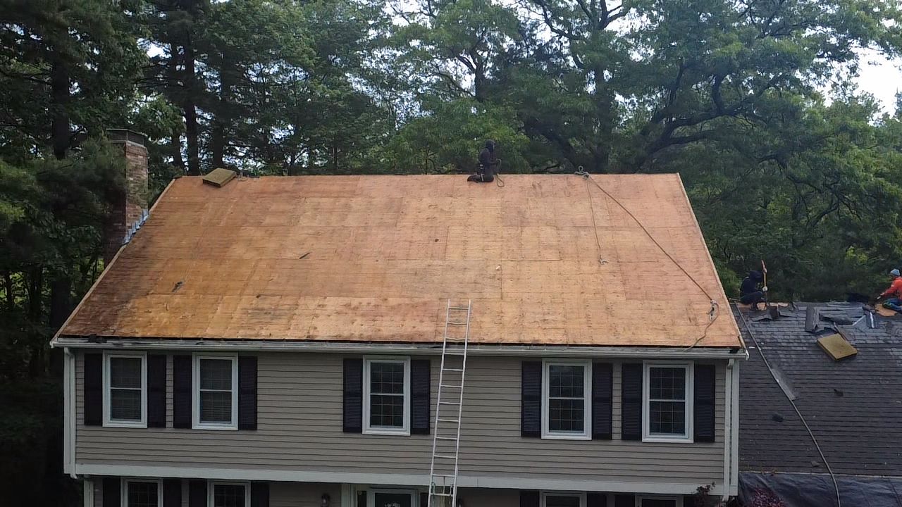 Roof replacement in progress on home in Walpole MA