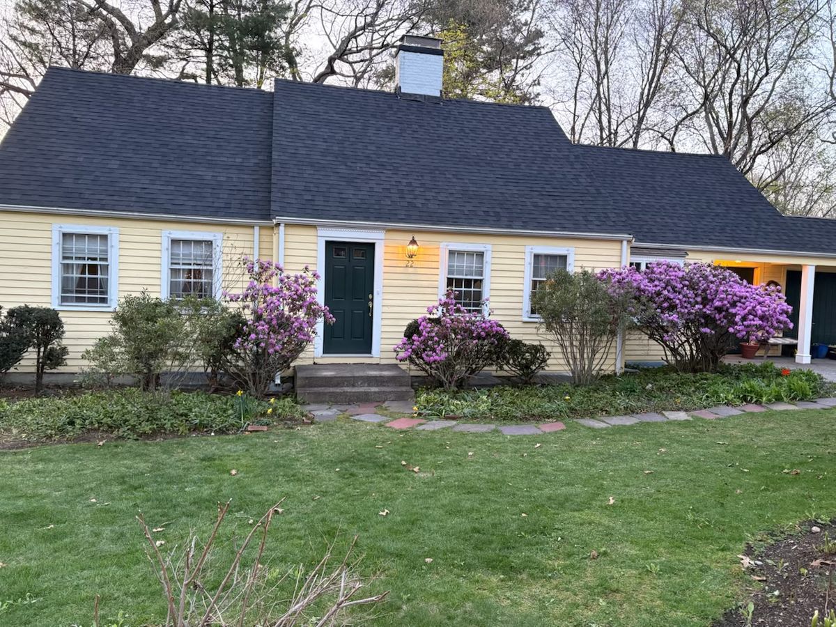Newly completed IKO architectural shingle roof installation on a cape style house in Wellesley MA.