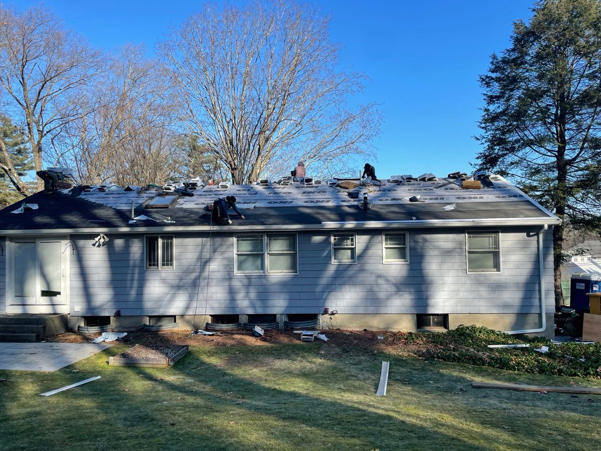 Our skillful crew installing ice and water shield and prepping the roof on a project in Wellesley MA