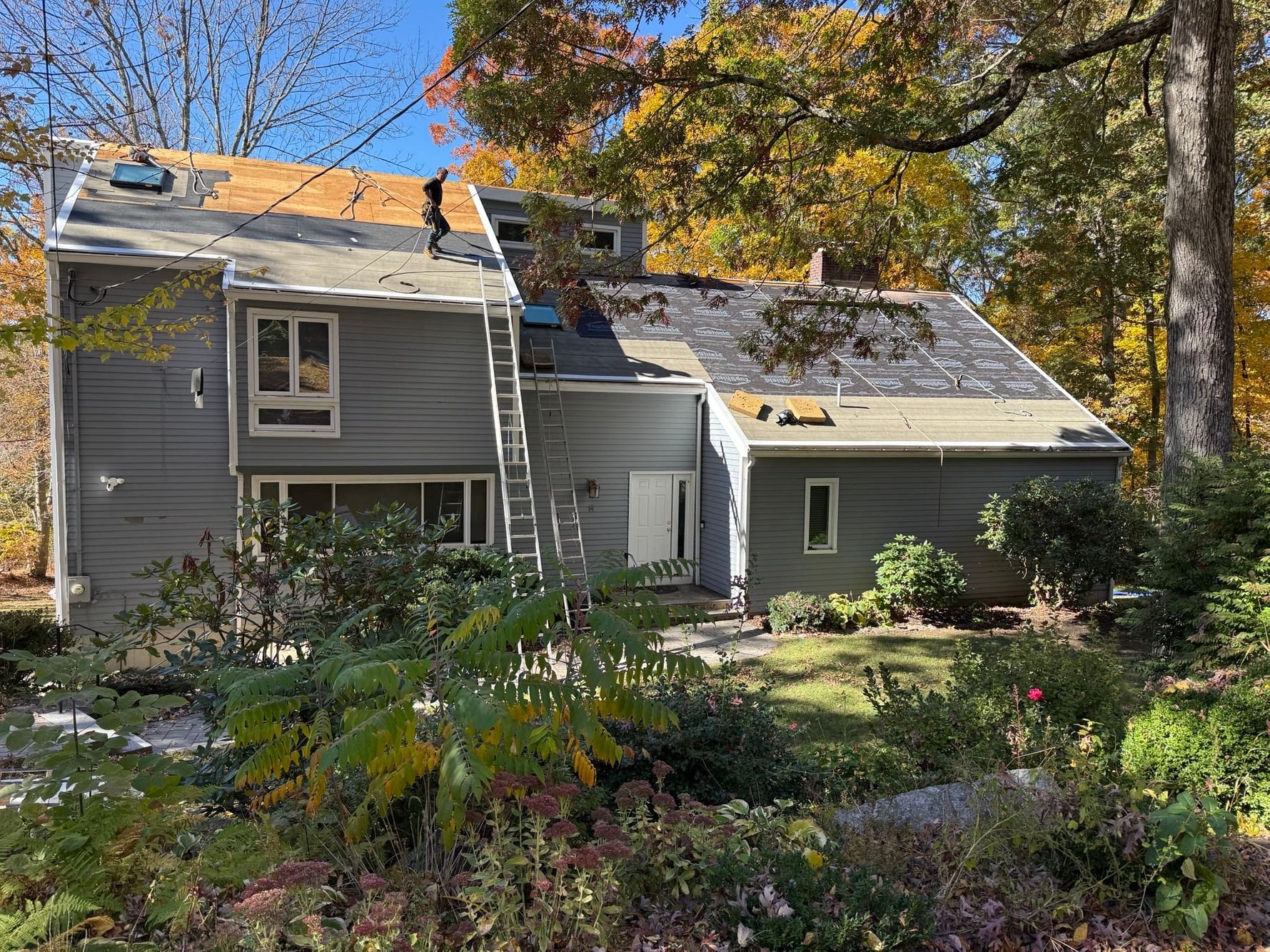 Roof installation with ice & water shield and new skylights