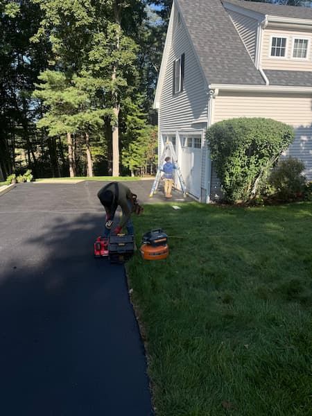 natarelli & son roofing and gutters crew preparing to install metal standing seam install in natick ma