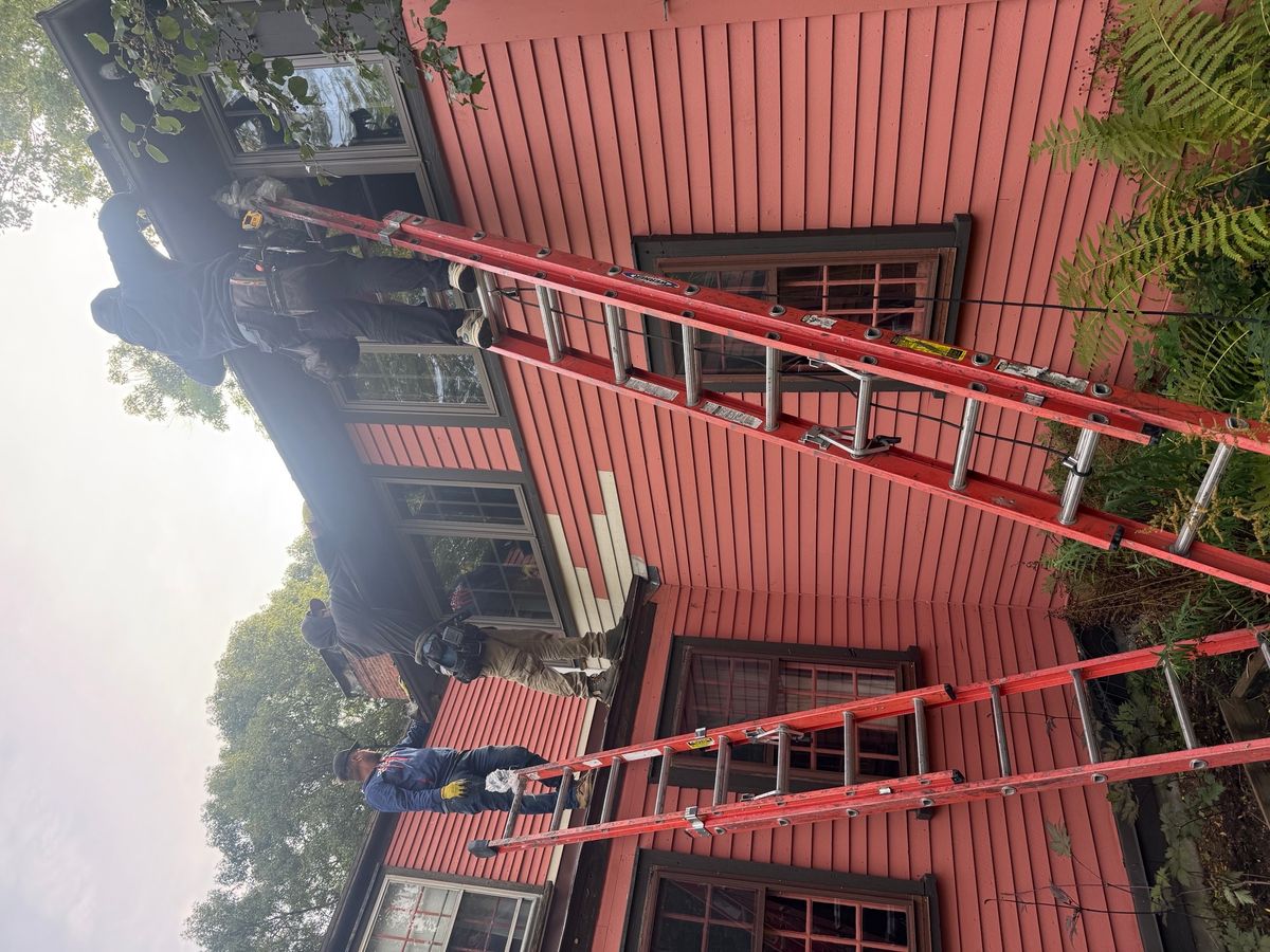 Brown aluminum Seamless Gutters being installed by Natarelli & Son Roofing and Gutters