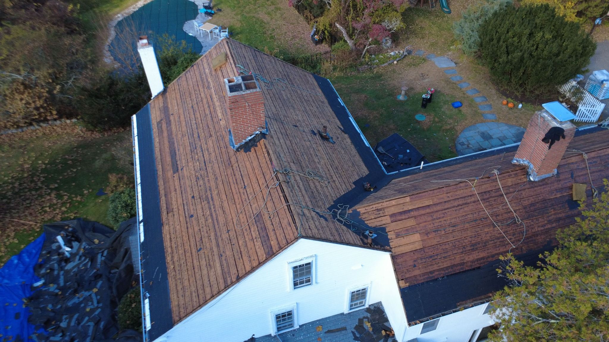 Drone view of Chimney and roof line - roof replacement on historic Samuel Dunton House in Norfolk, Massachusetts Another view of Chimney and roof line - roof replacement on historic Samuel Dunton House in Norfolk, Massachusetts