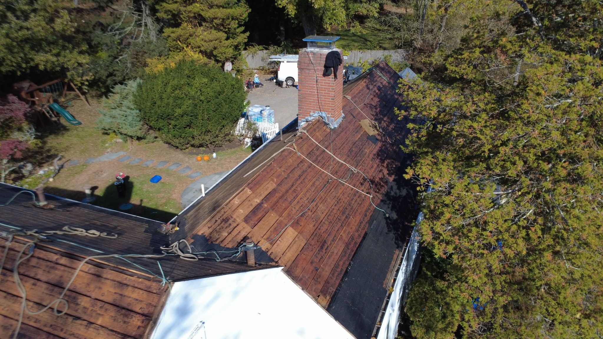 Drone view of Roofing work in progress on the historic Samuel Dunton House in Norfolk, Massachusetts Roofing work in progress on the historic Samuel Dunton House in Norfolk, Massachusetts