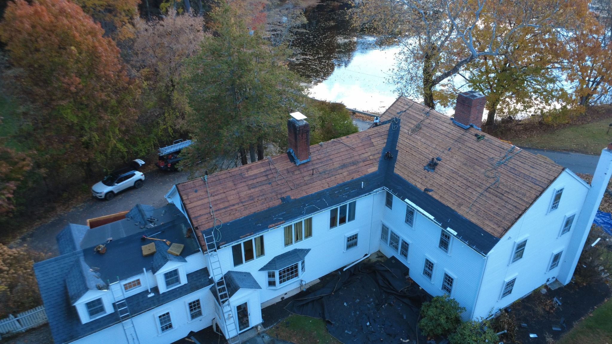 Drone view of full house Roofing work in progress on the historic Samuel Dunton House in Norfolk, Massachusetts Full house Roofing work in progress on the historic Samuel Dunton House in Norfolk, Massachusetts