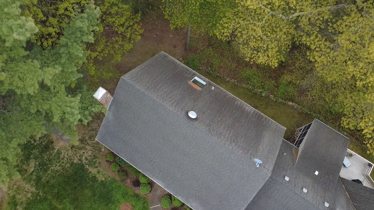Worn asphalt shingle roof before replacement in Walpole MA