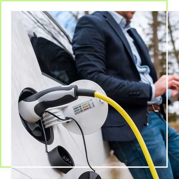 man waiting for car to charge