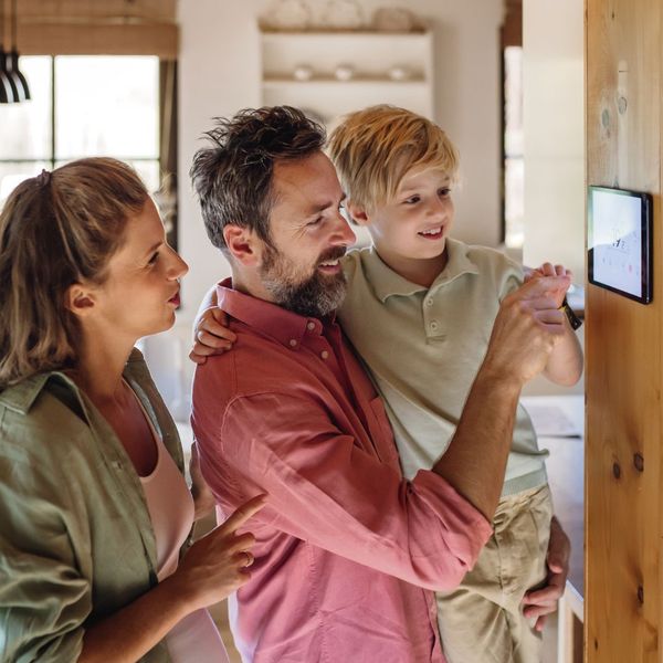 family checking thermostat