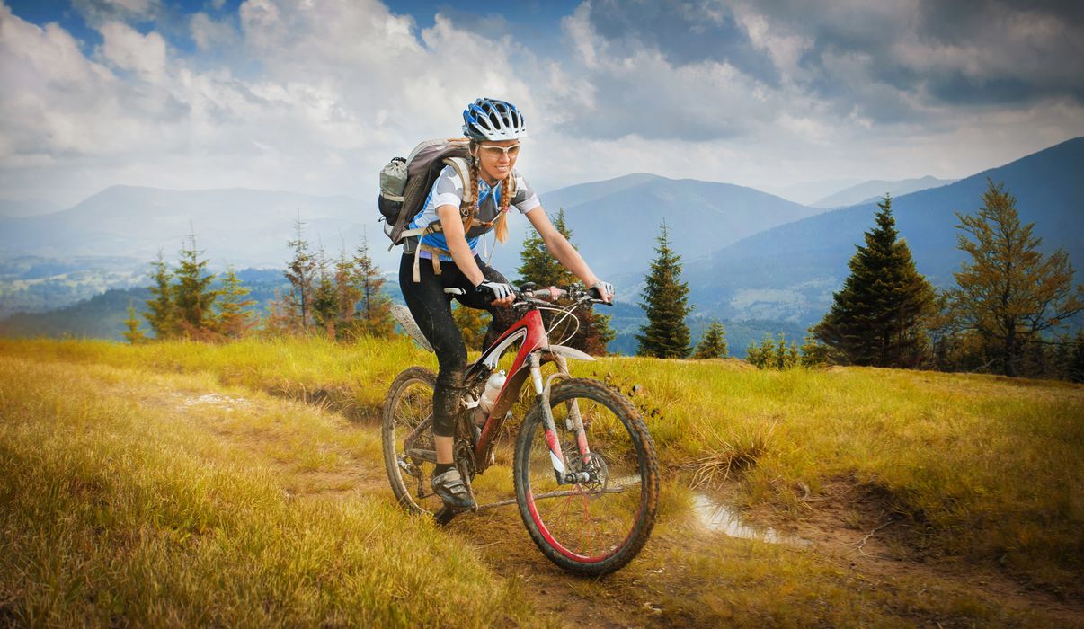 woman mountain biking