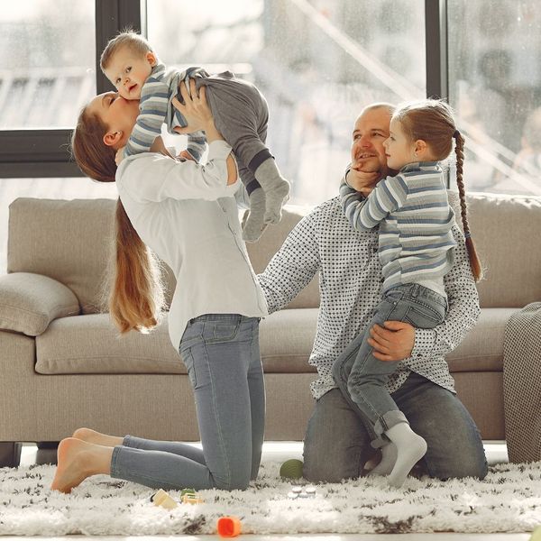 happy family playing in living room happy family playing in living room