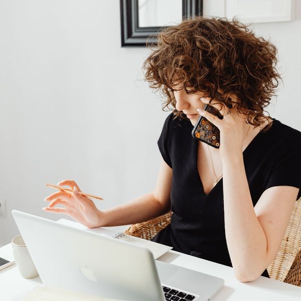woman at desk on the phone