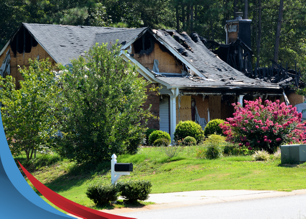 house with fire damaged roof 