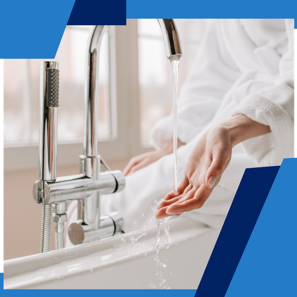 person waiting for warm water to fill a tub