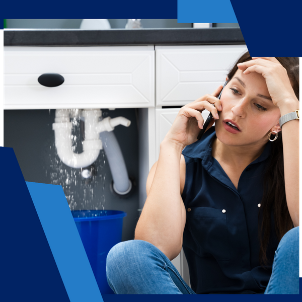 woman calling plumber with leaking pipes behind her woman calling plumber with leaking pipes behind her