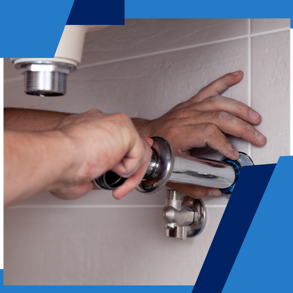 plumber fixing a sink