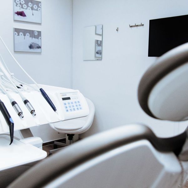 Dental office equipment with wall art in background