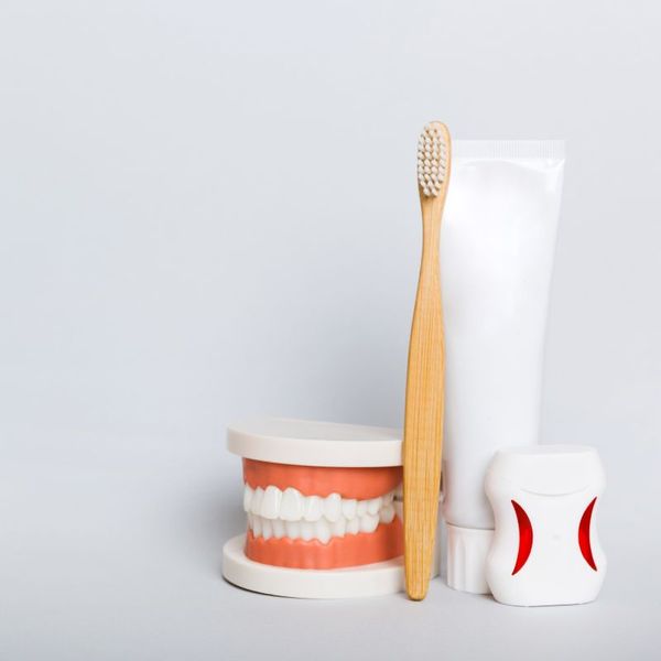 Toothbrush, toothpaste, floss, and dental model setup