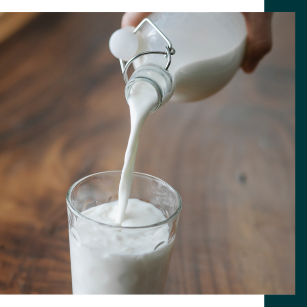 milk being poured into a glass