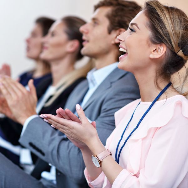 people at conference clapping