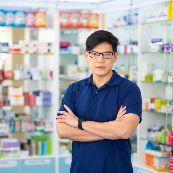 pharma rep standing in front of pharmacy products