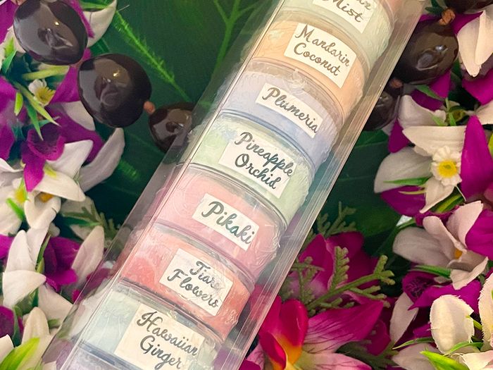 A stack of the handmade Hawaiian candles that you can include in the custom gift boxes from Ohanale. 