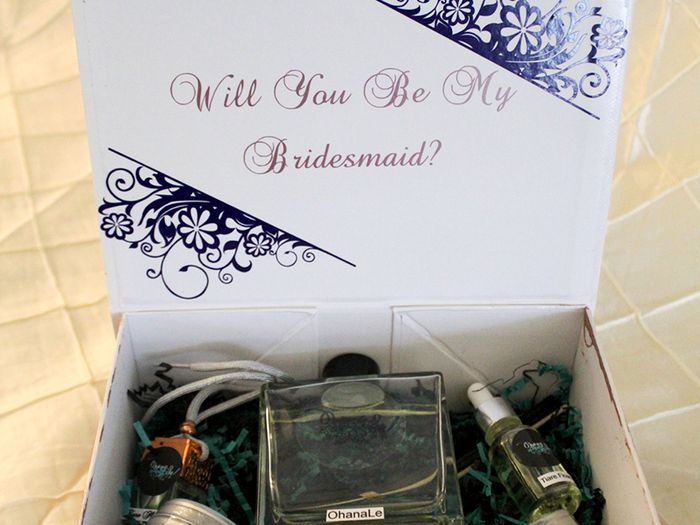  A picture of a custom gift box for a bachelorette party. Gift box made by Ohanale and includes candles, scented oils, and personalized crafts. 
