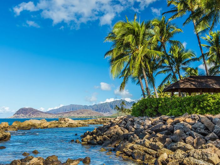 A view of the leeward coast and the Waianae Mountain Range from a secret beach at Ko Olina resort on west Oahu, Hawaii