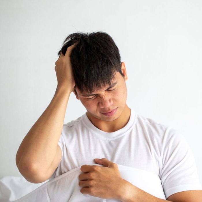 Grabbing head in pain