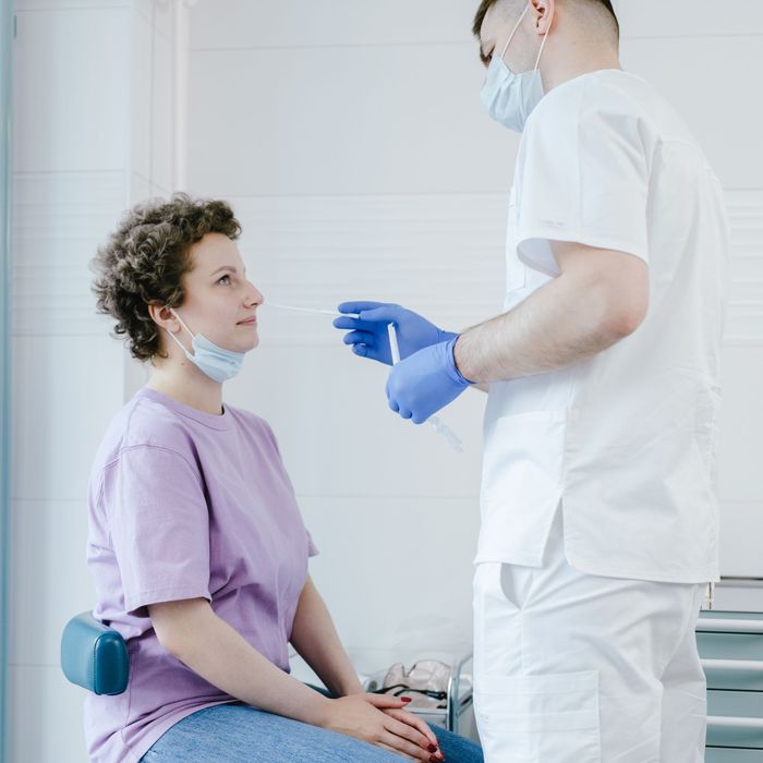 Nurse giving a patient a covid test