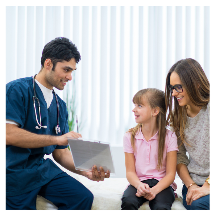 A child and her mother visiting a doctor 