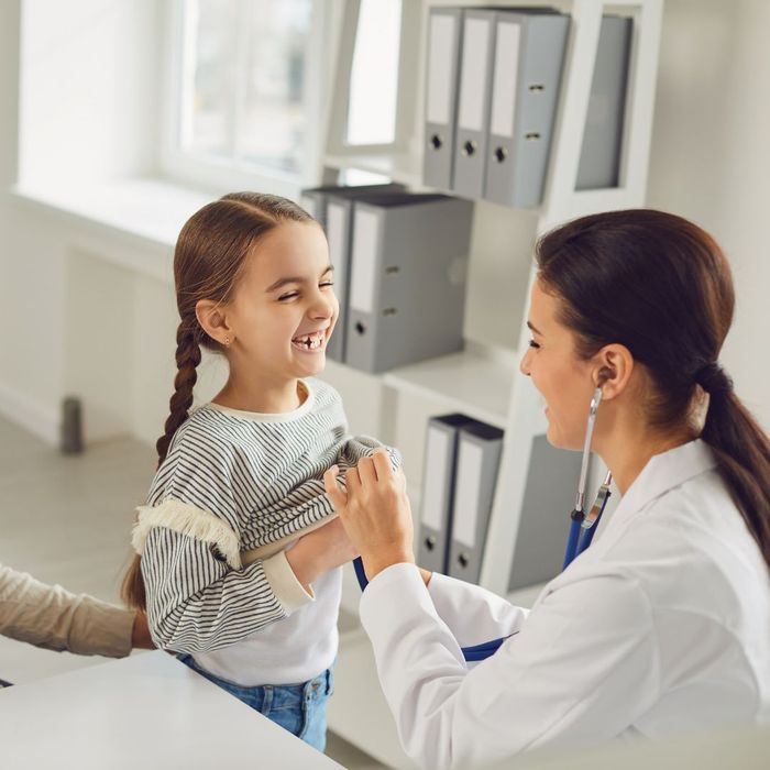 A child speaking to a doctor
