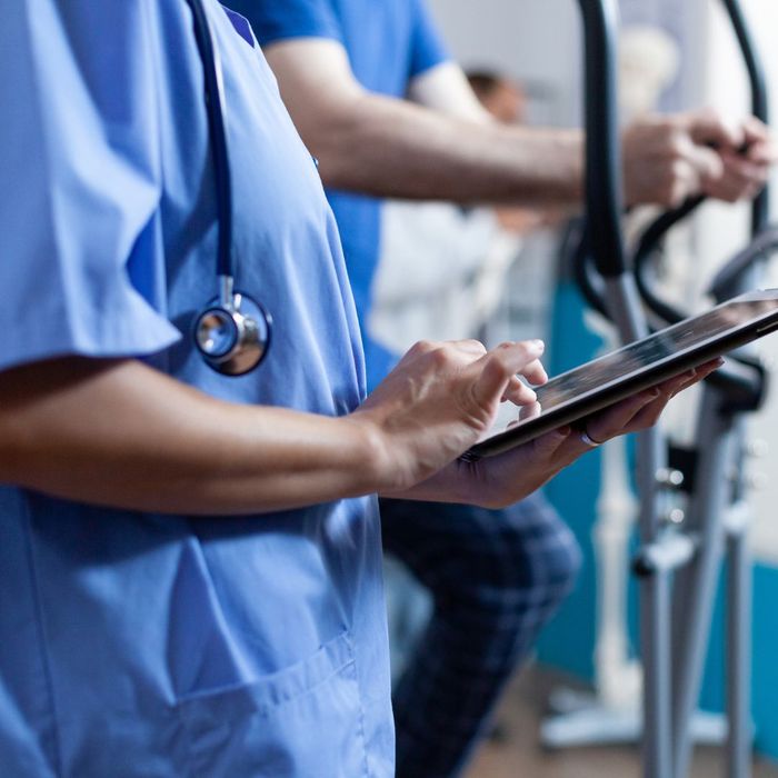 A doctor using a tablet