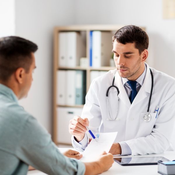 A man discussing something with a doctor