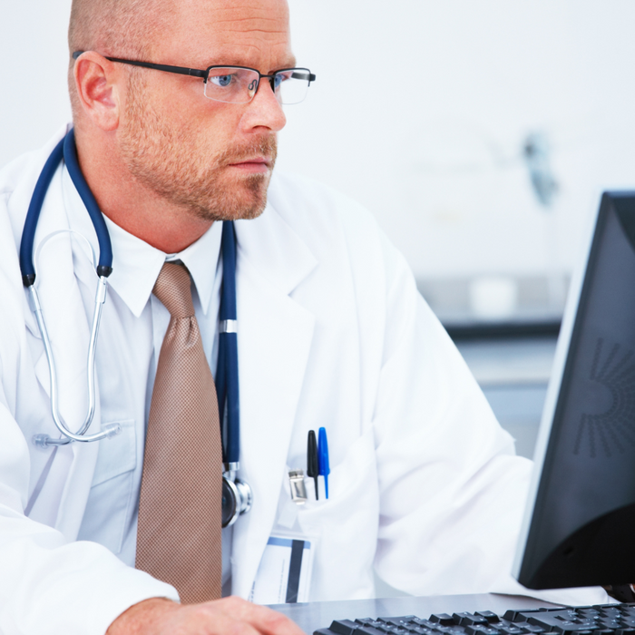 A doctor using a pc