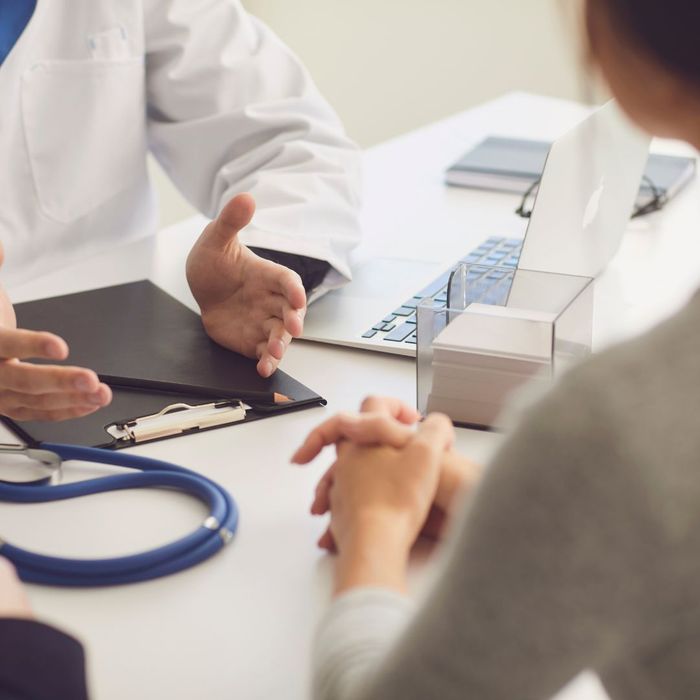 A doctor speaking to a patient