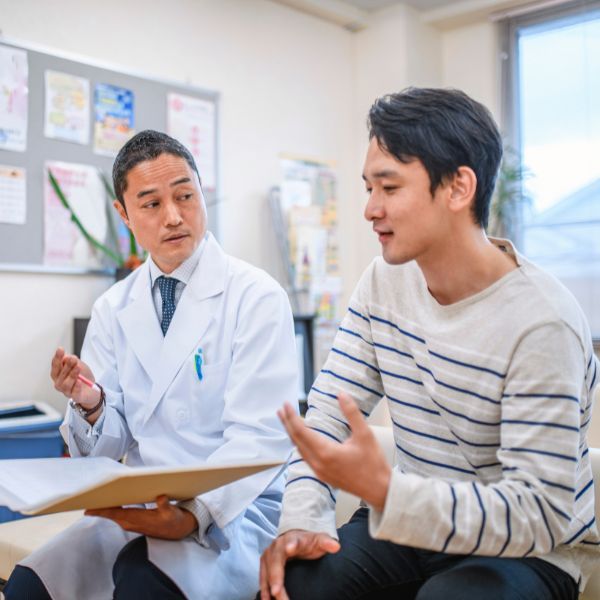 A man speaking with his doctor