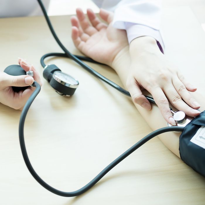 Doctor measuring blood pressure