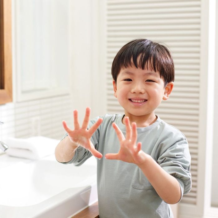 Child cleaning his hands
