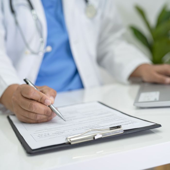 Doctor going over a document