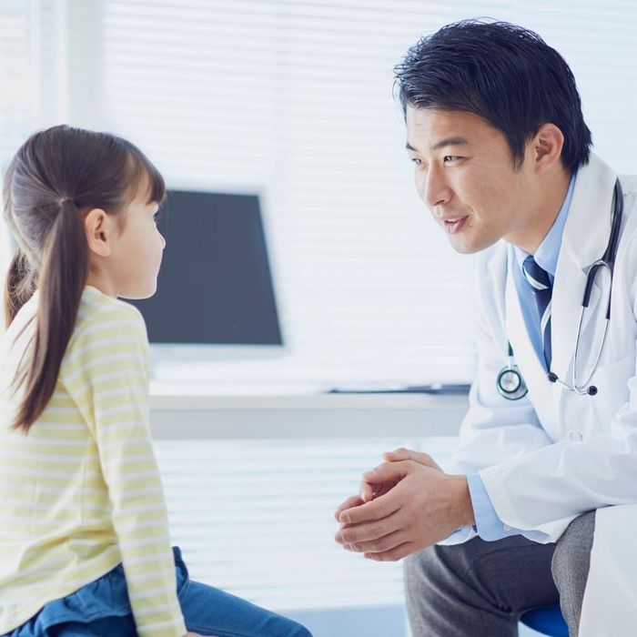 Doctor speaking with a child