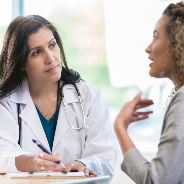 A patient speaking to their doctor 