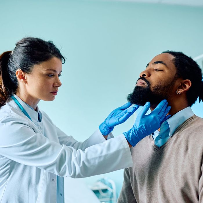 A doctor inspecting a patient