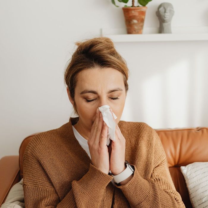woman sneezing