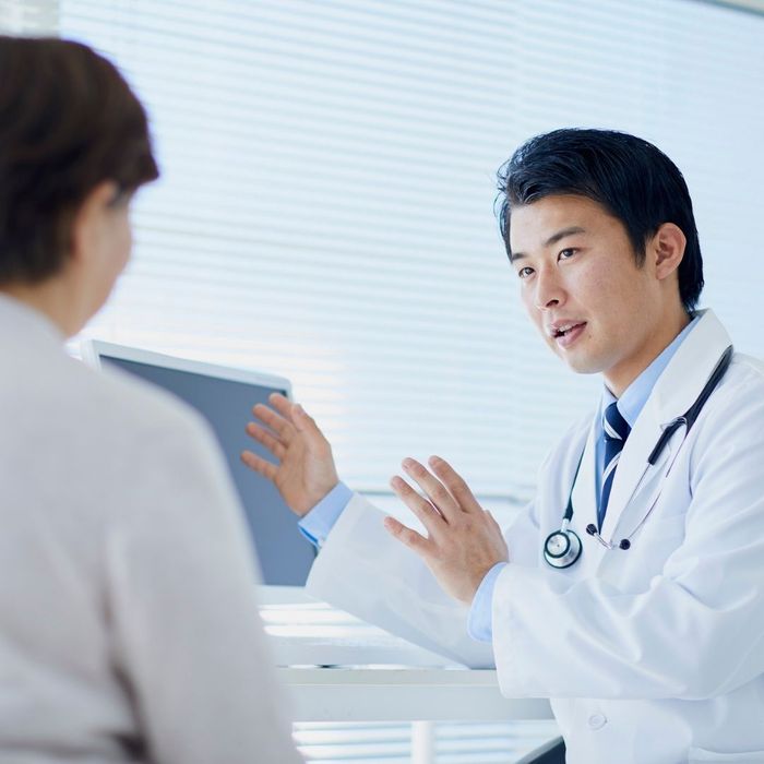 Doctor speaking to patient