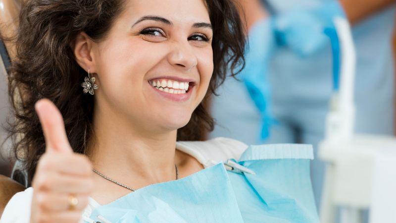 smiling woman at dentist