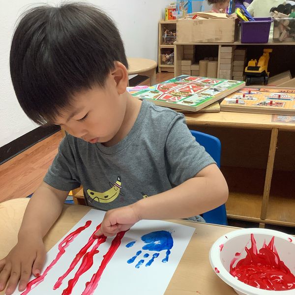 child finger painting American flag child finger painting American flag