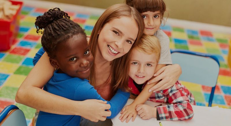 teacher hugging kids 