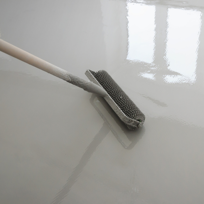 concrete floor coating being poured