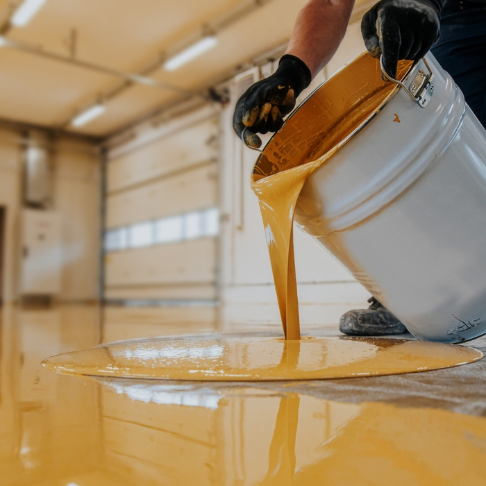 concrete floor coating being poured