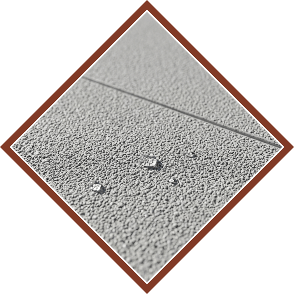 Close-up of water on a commercial concrete deck